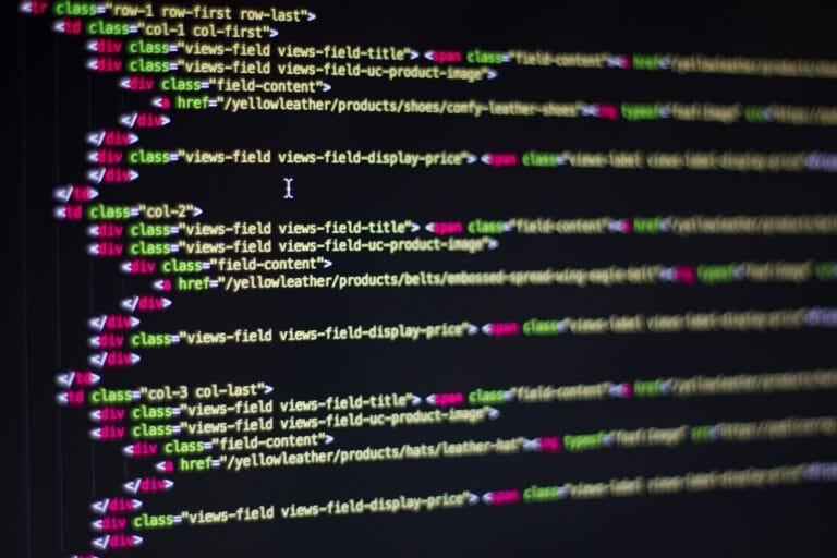 Developer writing code on a laptop