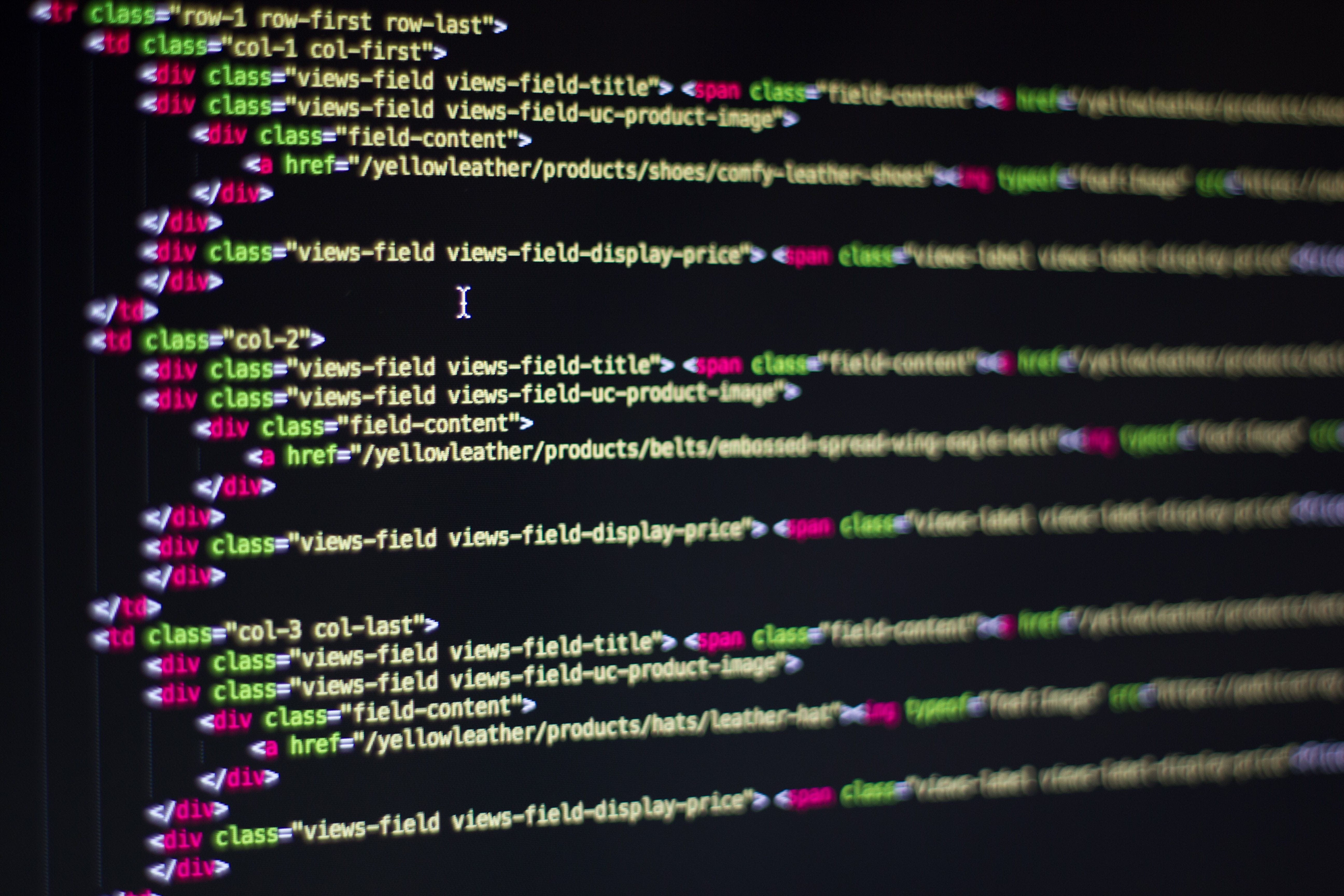 Developer writing code on a laptop